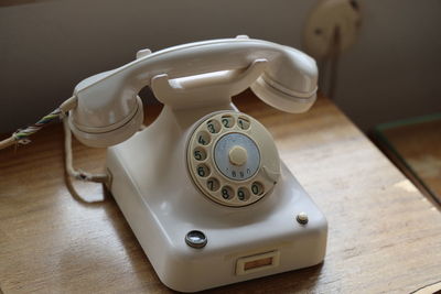 Close-up of telephone on table