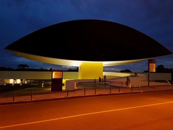 Empty road against sky at night