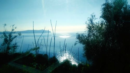 Scenic view of lake against sky at sunset