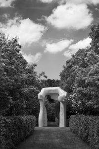 Gazebo in garden against sky