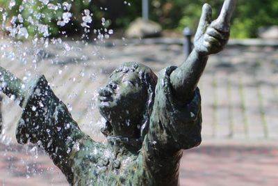 Close-up of water splashing statue