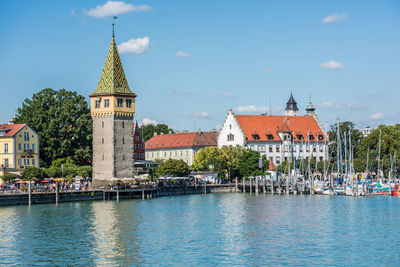 Panoramic view of building by city against sky