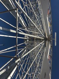 Low angle view of ferris wheel against sky