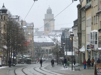 People walking on road in city