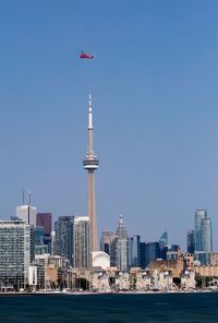 View of buildings in city against clear sky