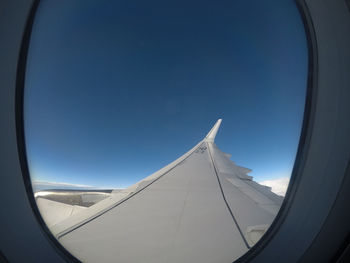 Directly below shot of sky seen through airplane window