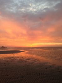 Scenic view of beach against sky during sunset