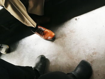 Low section of man standing on floor