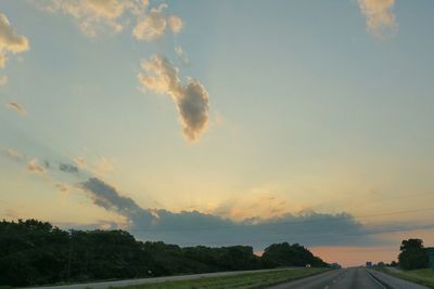 Scenic view of landscape against cloudy sky