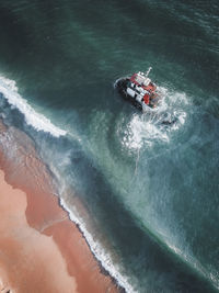 High angle view of man surfing in sea