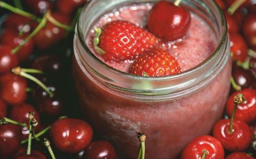 High angle view of strawberries in glass container