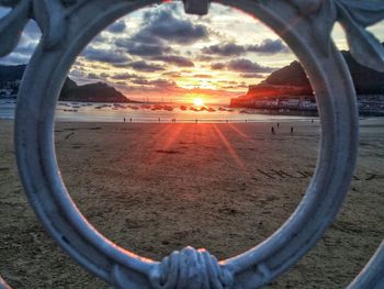 Scenic view of beach against sky during sunset