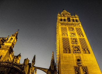 Low angle view of clock tower against sky