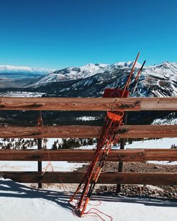 Snow covered mountain against blue sky