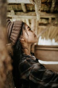 Portrait of young woman in hat