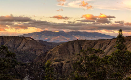 Scenic view of mountains against sky during sunset