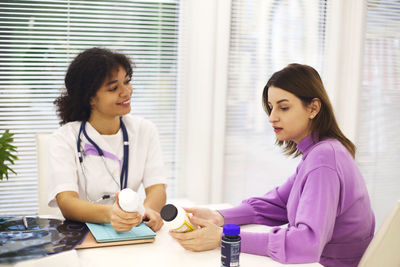 Patient discussing with doctor at clinic