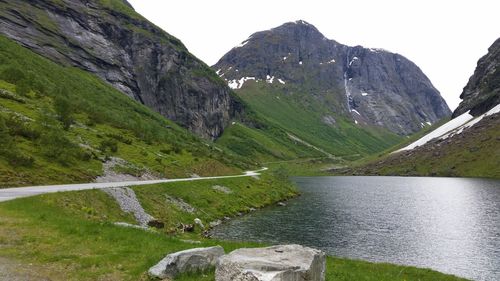 Scenic view of mountains and lake against sky