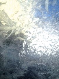 Close-up of frozen landscape against sky