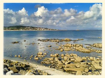 Scenic view of sea against cloudy sky