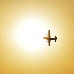 Low angle view of airplane against clear sky