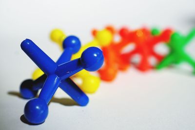 Close-up of colorful toy over white background