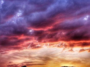 Low angle view of dramatic sky during sunset