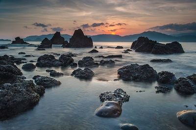 Scenic view of sea at sunset