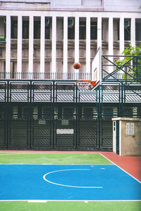View of basketball court against building