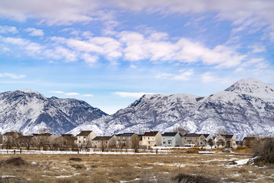 Scenic view of snowcapped mountains against sky during winter