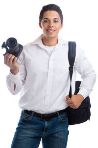 Portrait of smiling young man standing against white background