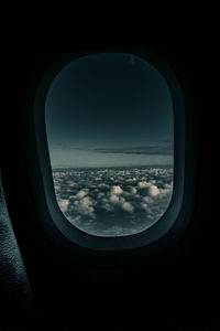 Scenic view of cloudscape seen through airplane window