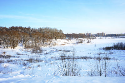 Scenic view of snow covered landscape against sky