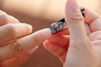 Close-up of man holding woman hand