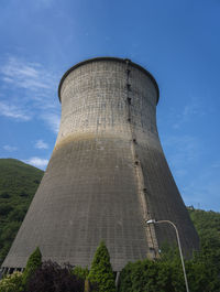 Low angle view of smoke stack against sky