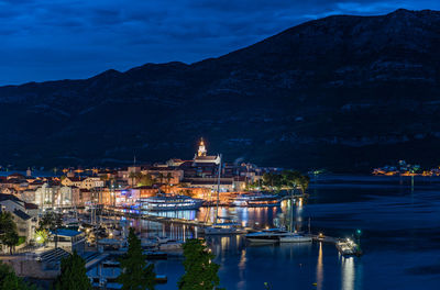 Illuminated buildings in city at night