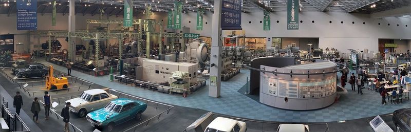 Panoramic shot of machines and cars in industry