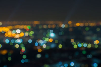 Defocused image of illuminated lights at night