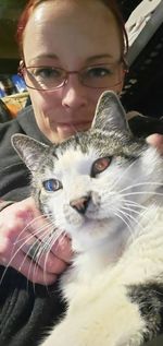 Portrait of woman with cat