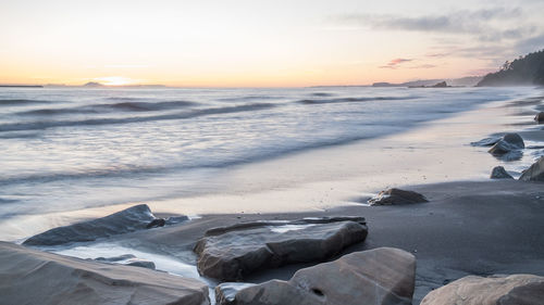 Scenic view of sea against sky during sunset
