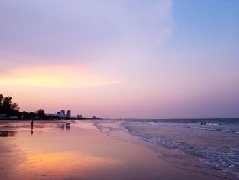 Scenic view of beach against sky during sunset