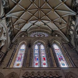 Low angle view of ornate window in building