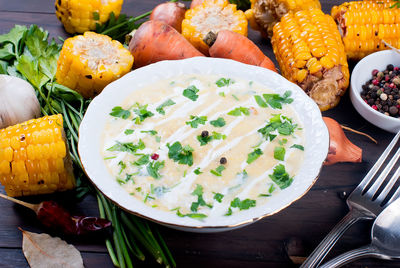 High angle view of vegetables in plate on table