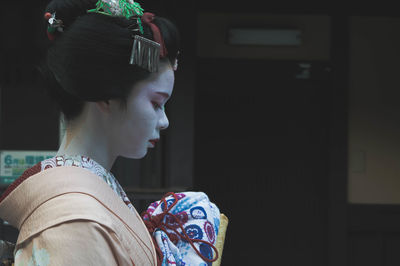 Close-up portrait of woman looking away