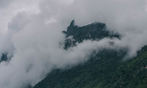 Scenic view of mountains against sky during winter