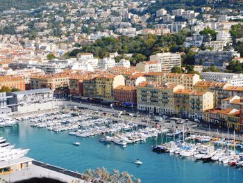 High angle view of boats moored at harbor