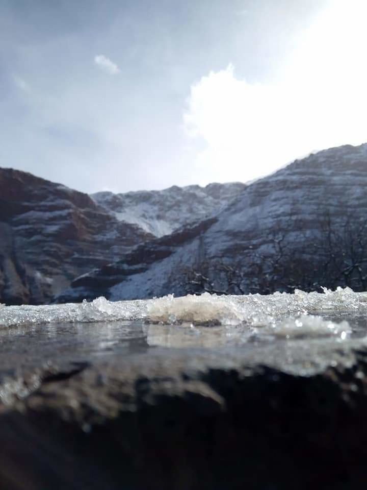 mountain, sky, cloud - sky, day, scenics - nature, nature, no people, beauty in nature, tranquility, tranquil scene, cold temperature, winter, snow, outdoors, environment, landscape, mountain range, selective focus, non-urban scene, snowcapped mountain, mountain peak, surface level