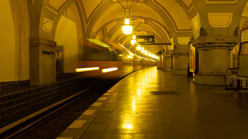 Illuminated railroad station platform