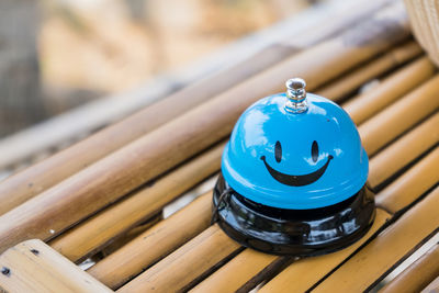 High angle view of blue metal container on table