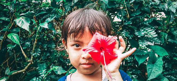 Portrait of boy with plants